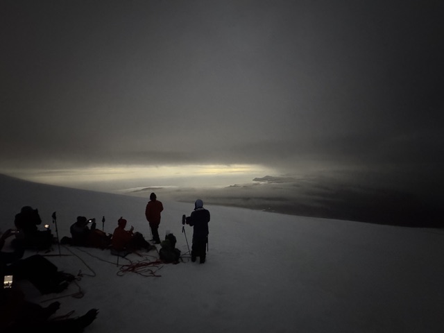 AnnMarie Castrigno's group near the summit of Snæfellsjökull glacier in near-total darkness during the total solar eclipse