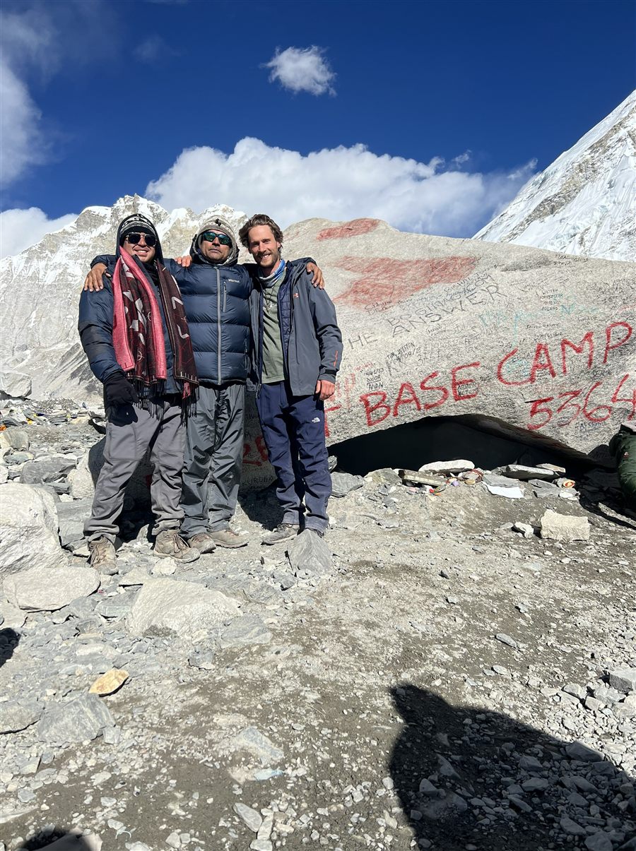 Alex Huang at the Everest Base Camp marker, elevation 5,364 metres